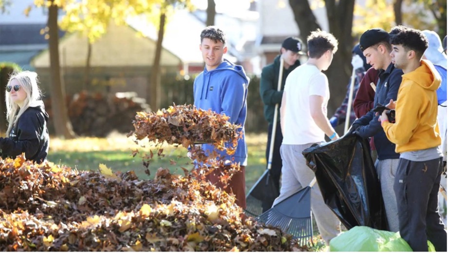 Students participating in Shake-a-rake community service event